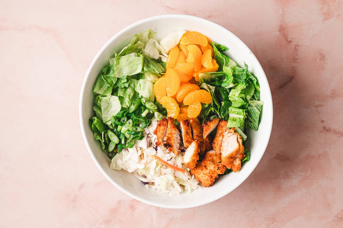 Asian chicken salad ingredients in a bowl