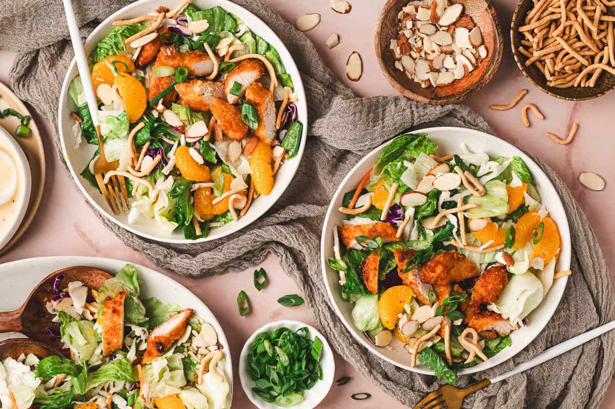 Overhead view of plates of Asian chicken salad