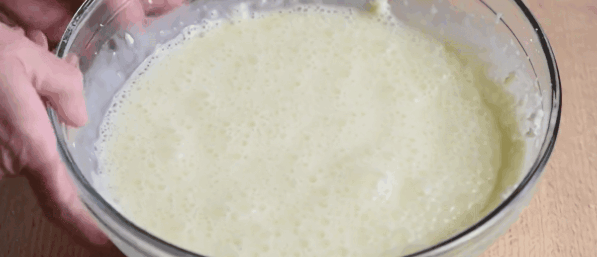 Custard for bread pudding in a glass bowl.