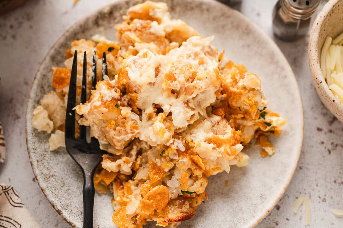 Plate of funeral potatoes with a fork.