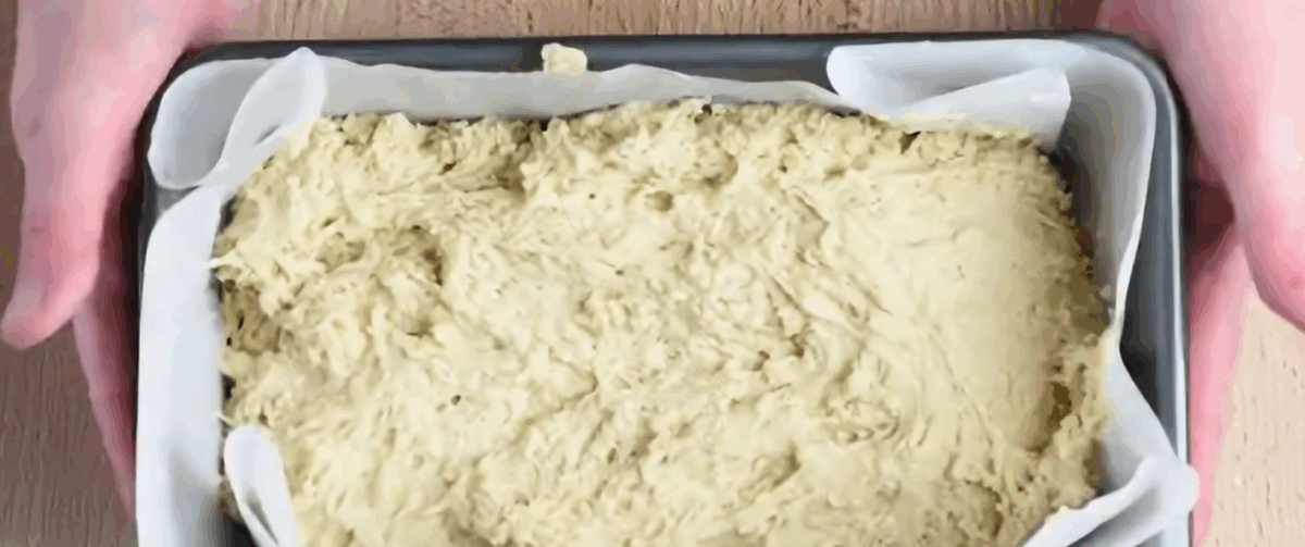 Beer bread batter in a loaf pan.