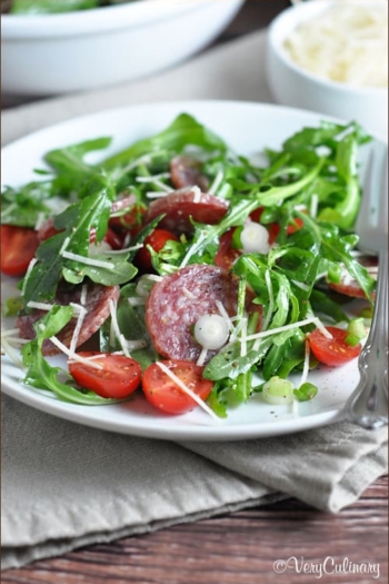 This salami salad comes together in 15 minutes, with baby greens, sweet cherry tomatoes, Parmesan, and a light dressing.