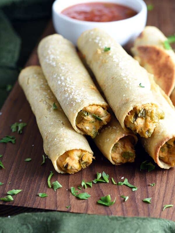 These chicken and cheese baked taquitos have the delicious flavor and crispy shell of the beloved deep fried version, but are easier, less messy, and healthier. Make them ahead, freeze, and have them ready in just minutes!