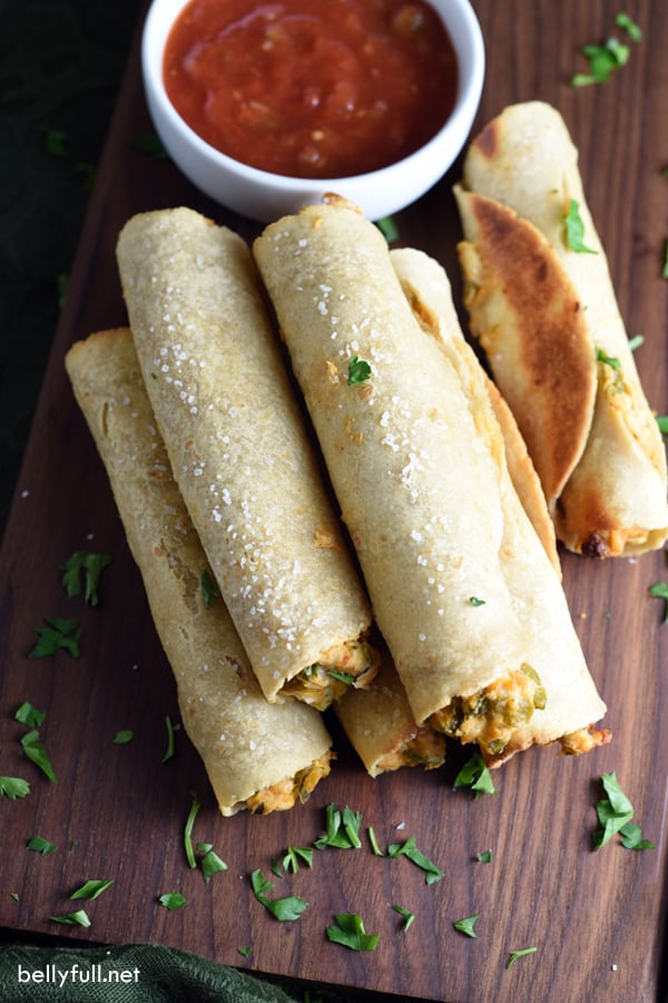 stacked taquitos on cutting board!