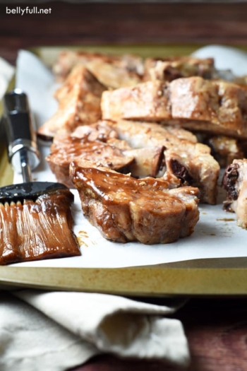 Baby Back Ribs are slow cooked in the oven with a delicious spice rub and a sweet and spicy sauce. After a few hours, the meat just falls off the bone!