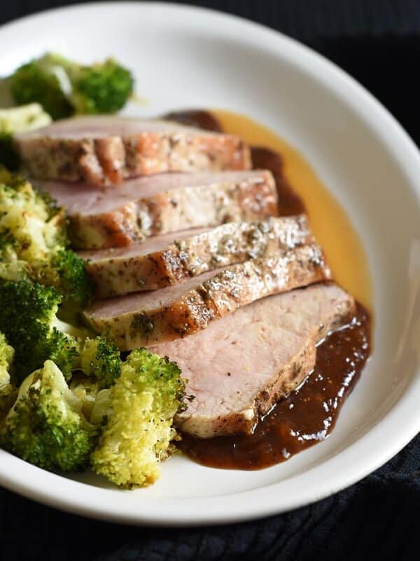 Pork loin filet is rubbed with salt, pepper, and thyme, then roasted and topped with a sublime fig sauce. Festive and simple, perfect for holiday entertaining!