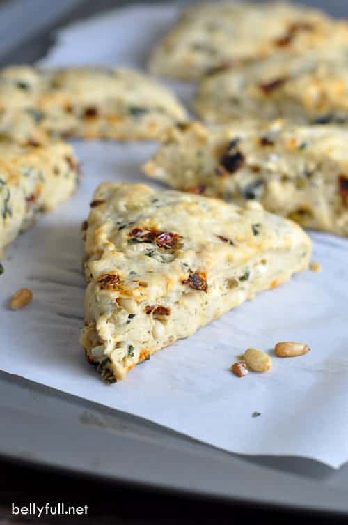 Bruschetta Scones - a savory scone with almond milk, spinach, basil, sun-dried tomatoes, pine nuts, feta cheese, and of course olives!