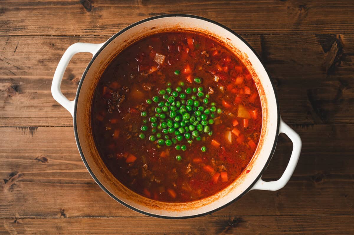 Frozen peas added to simmering chuck wagon stew near the end of cooking.