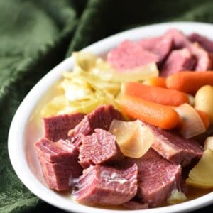 Slow Cooker Thai Coconut Corned Beef and Cabbage - red curry paste and coconut milk give this typical meal a Thai flair, thatโs subtly sweet and rich. All done in the crockpot. The wonderful broth lends itself toward a great soup, too!
