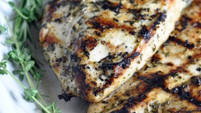 Grilled Chicken Breasts with Herbs and Lemon - this simple no-fail grilled chicken recipe can be enjoyed with any vegetable for an easy weeknight meal. Use up any left overs in a sandwich the next day!