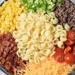 Bacon, ground beef, cheese, and hot sauce make this Cowboy Pasta Salad a definite crowd pleaser! Perfect for summer get togethers.