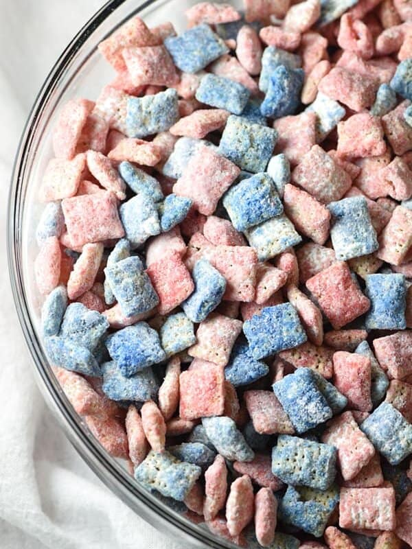 Red, White, and Blue Muddy Buddies - 15-minute Chex Mix Muddy Buddies with a holiday flair for the 4th of July! The most delicious and addicting snack ever!