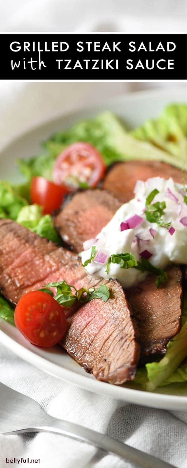 Grilled Steak Salad with Tzatziki Sauce - tender marinated steak is served on top of salad with a light and refreshing yogurt sauce for an easy, low-calorie meal!