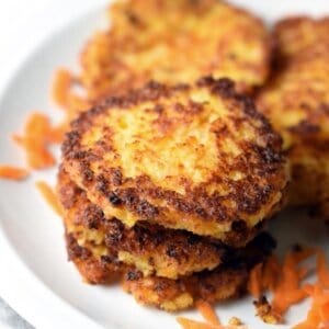 These Potato Carrot Latkes are the classic potato latke - or potato pancake, if you prefer - with added carrots. Perfect for Jewish holidays and Thanksgiving!