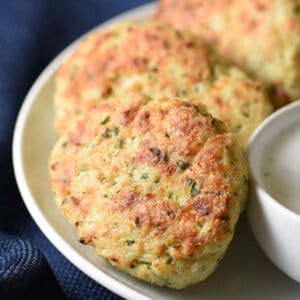 These Chicken Patties with Mint Yogurt Sauce are easy, healthy, and flavorful. Cooked under the broiler in just minutes!