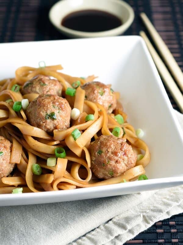 Traditional meatballs with an Asian twist, using ground pork, soy and hoisin sauces. Then served over sesame rice noodles for an easy and complete meal!