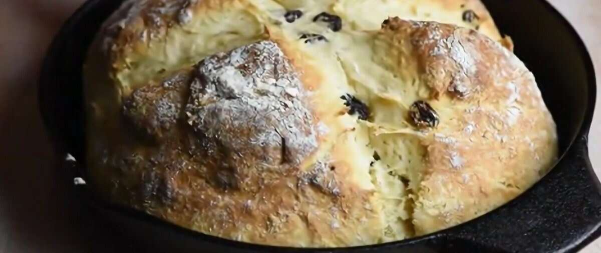 Baked bread in a cast iron skillet.