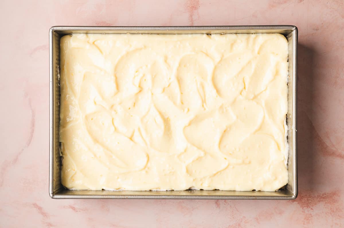 This Coconut Cream Lush is smooth, rich, light, and there’s no cooking involved. It’s so easy and perfect for summer gatherings! Coconut pudding mixture spread on top