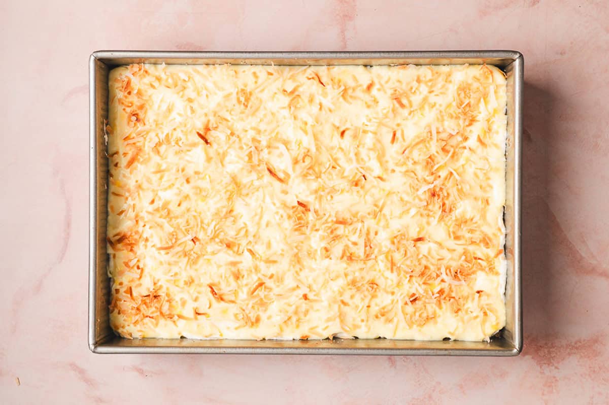 This Coconut Cream Lush is smooth, rich, light, and there’s no cooking involved. It’s so easy and perfect for summer gatherings! Toasted coconut spread on top