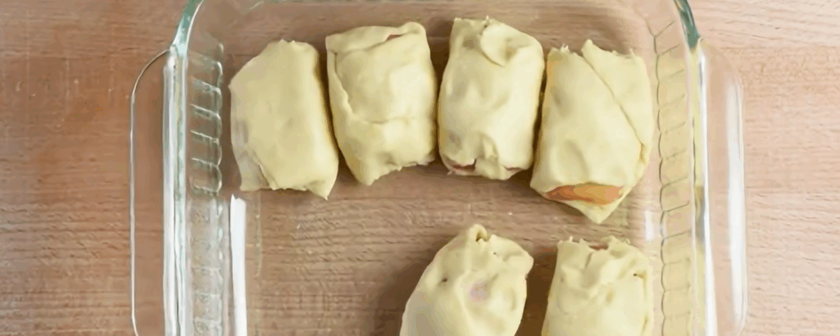 Apple dumplings in a glass baking dish.
