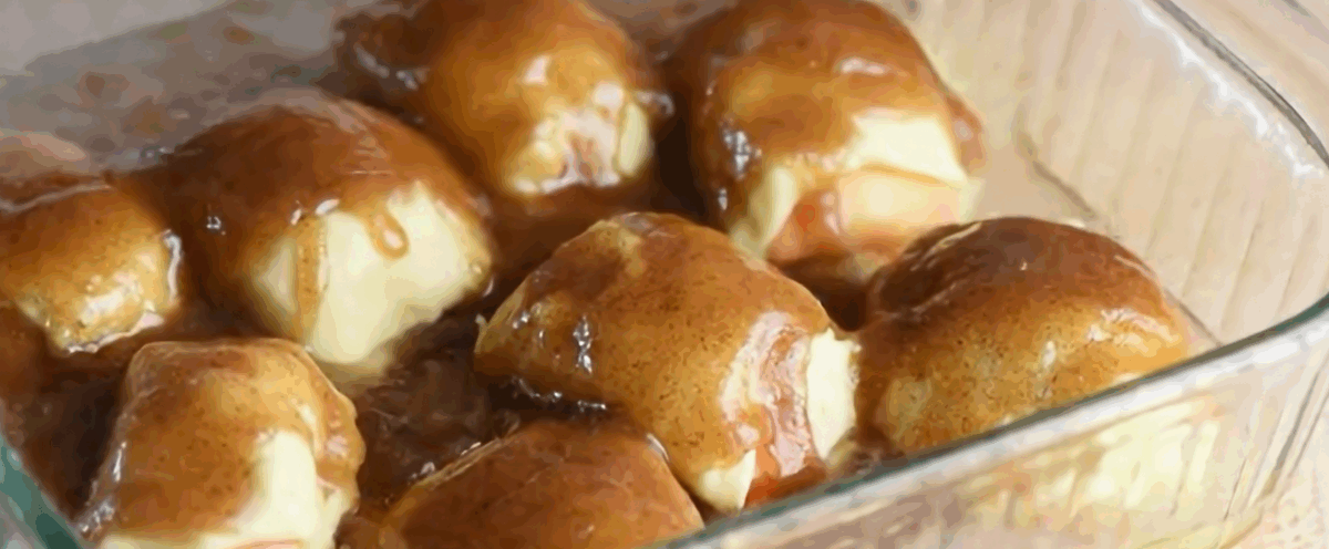 Pouring soda around the apple dumplings. 