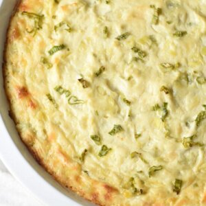 This is the best Artichoke Dip, with artichokes, Sriracha, Parmesan and Gruyere cheeses. Perfect for get togethers or game day!