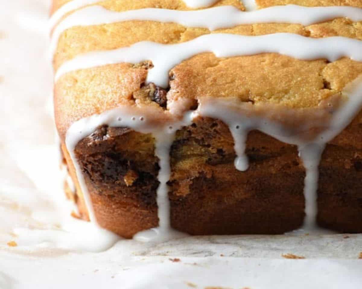 glaze poured over cinnamon roll quick bread