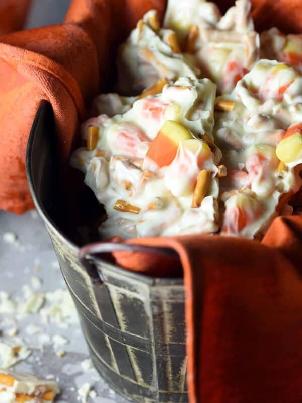 Halloween Candy Corn Pretzel Bark is the ultimate treat with white chocolate, candy corn, and pretzels!