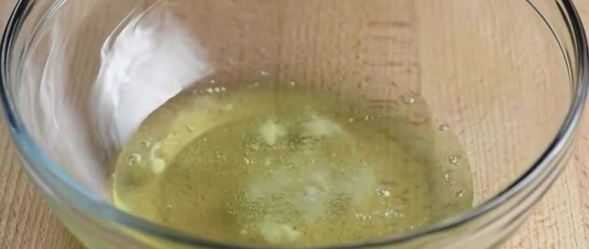 Egg whites in a bowl with a pinch of salt.