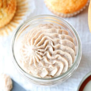 overhead picture of cinnamon honey butter piped into glass jar
