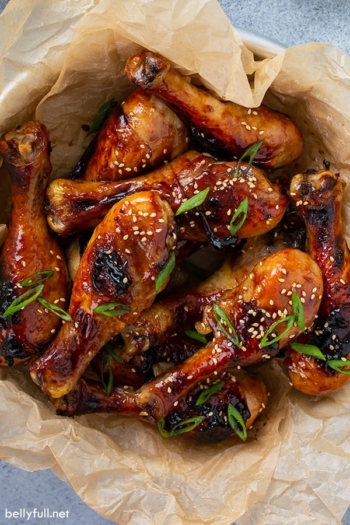 overhead picture of honey soy chicken drumsticks in bowl