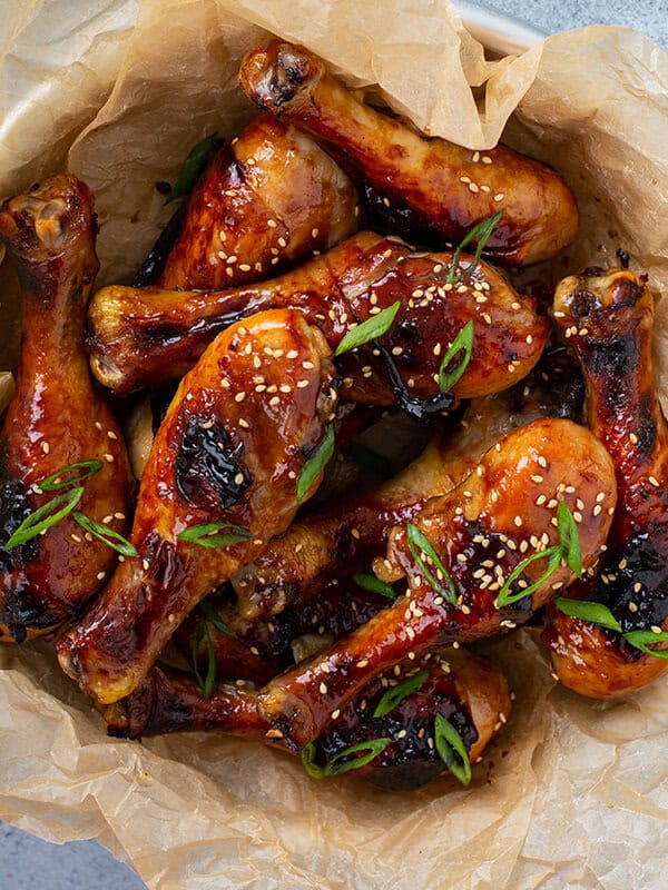 overhead picture of honey soy chicken drumsticks in bowl