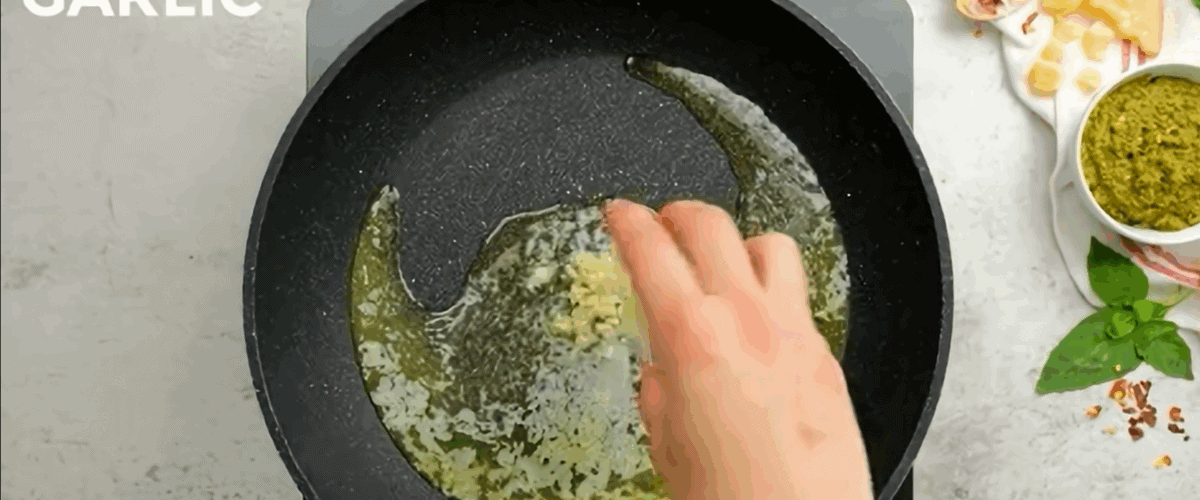 Cooking garlic in a skillet.