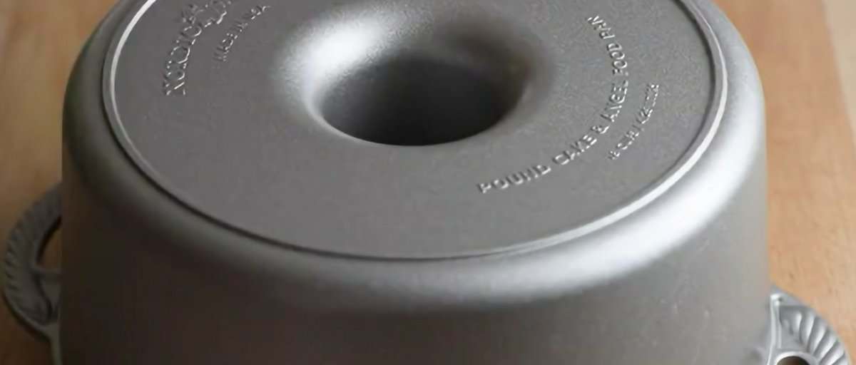 Angel food cake flipped over in the tube pan.