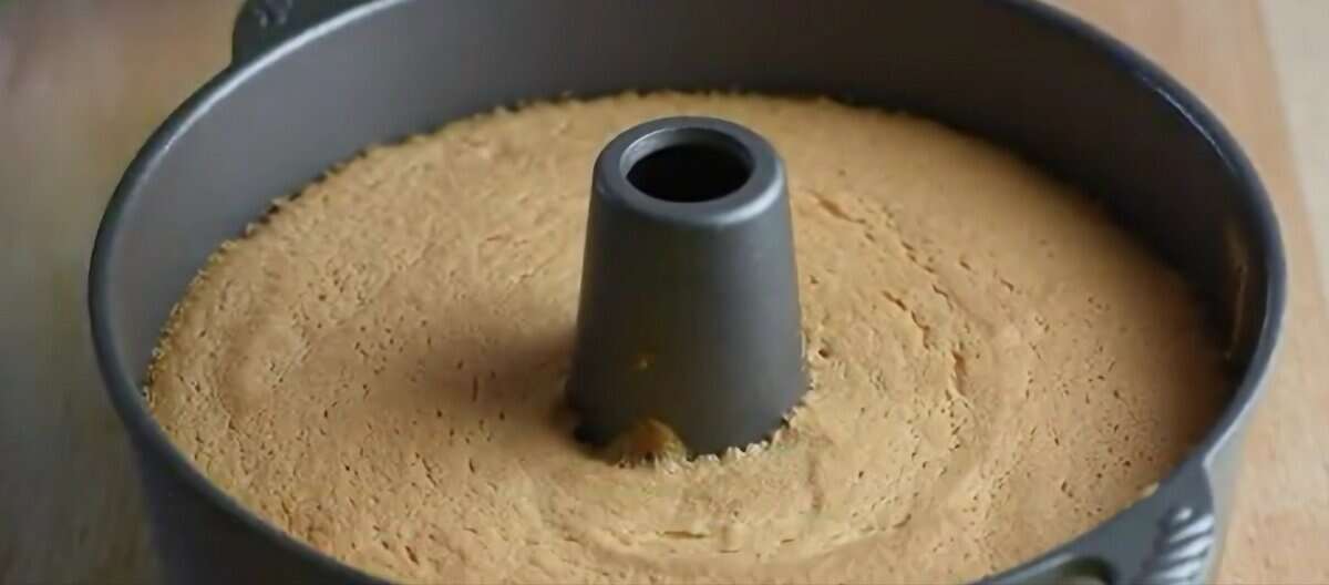 Baked angel food cake in a tube pan.