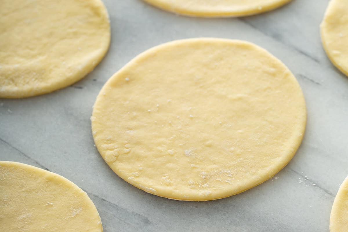 Pierogi dough rolled into circles.