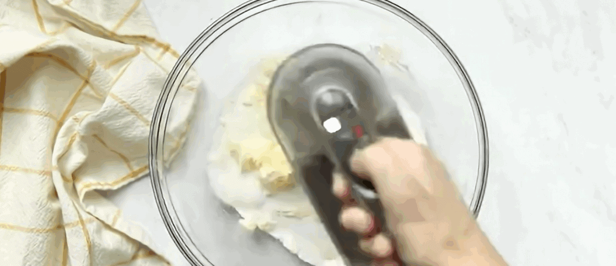 Creaming butter and sugar with a handheld blender. 
