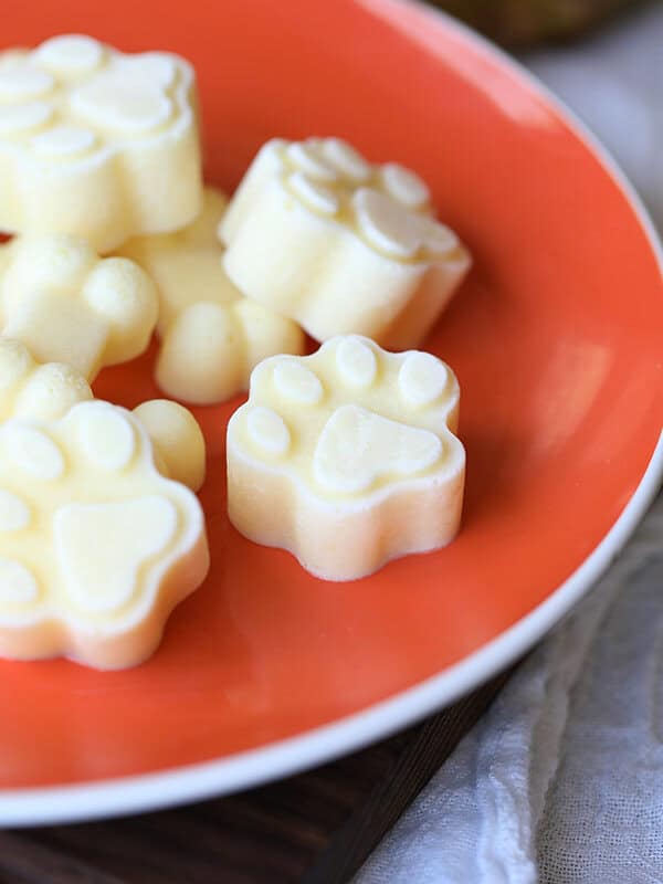 frozen pineapple dog treat in the shape of a paw print