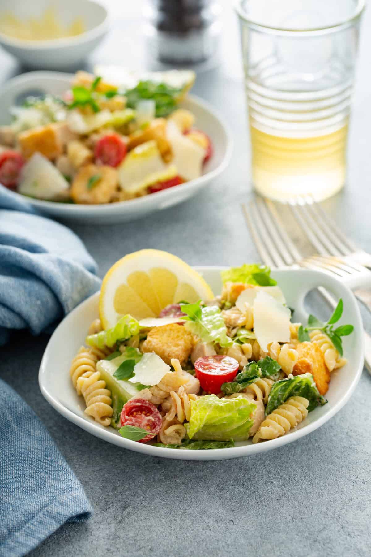 A plate of chicken Caesar pasta salad.