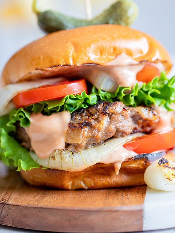 close up of grilled onion burger with all the fixins