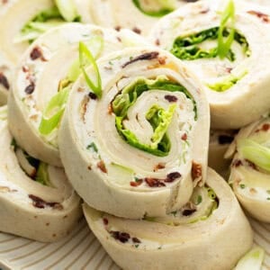close up of chicken salad tortilla roll ups on plate