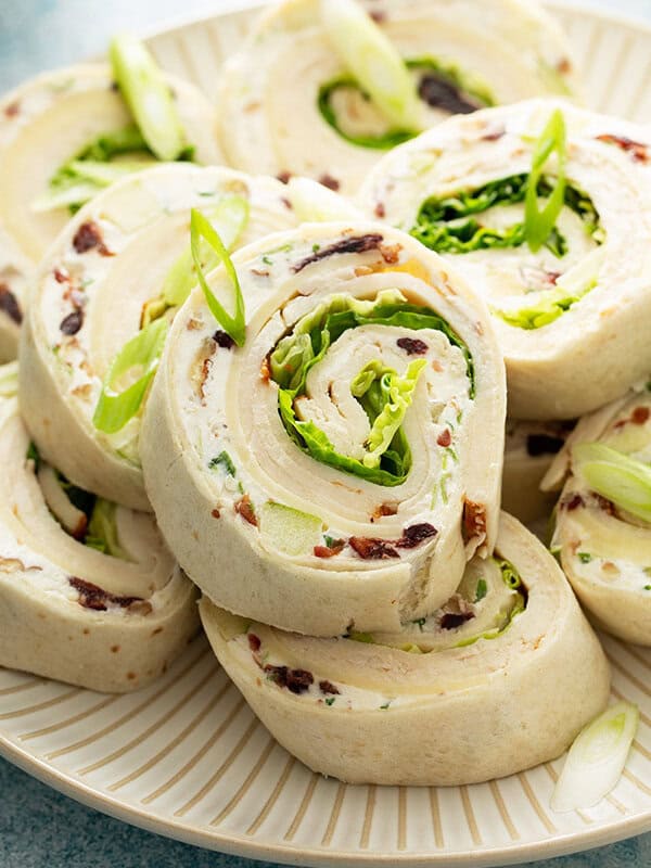 close up of chicken salad tortilla roll ups on plate