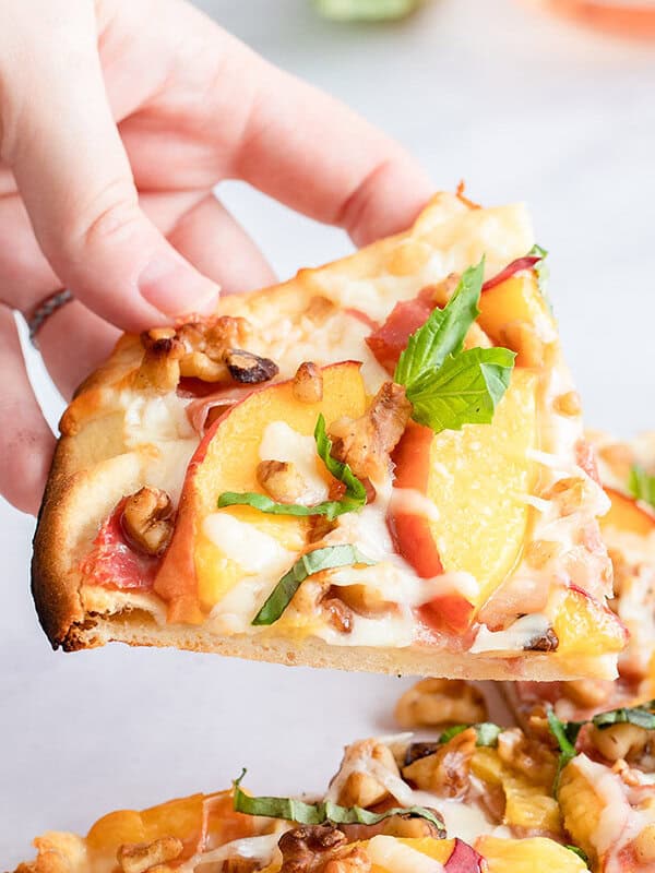 slice of flatbread pizza with coppa and peaches