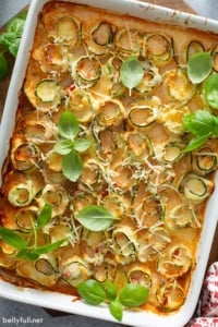 overhead of baked spiral zucchini rolls in white casserole dish