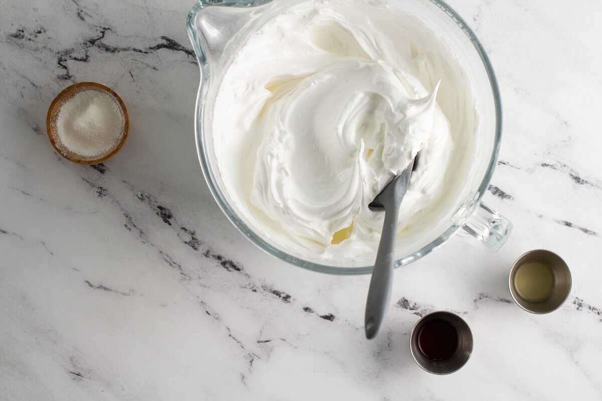 Whipping egg whites in a glass measuring cup.