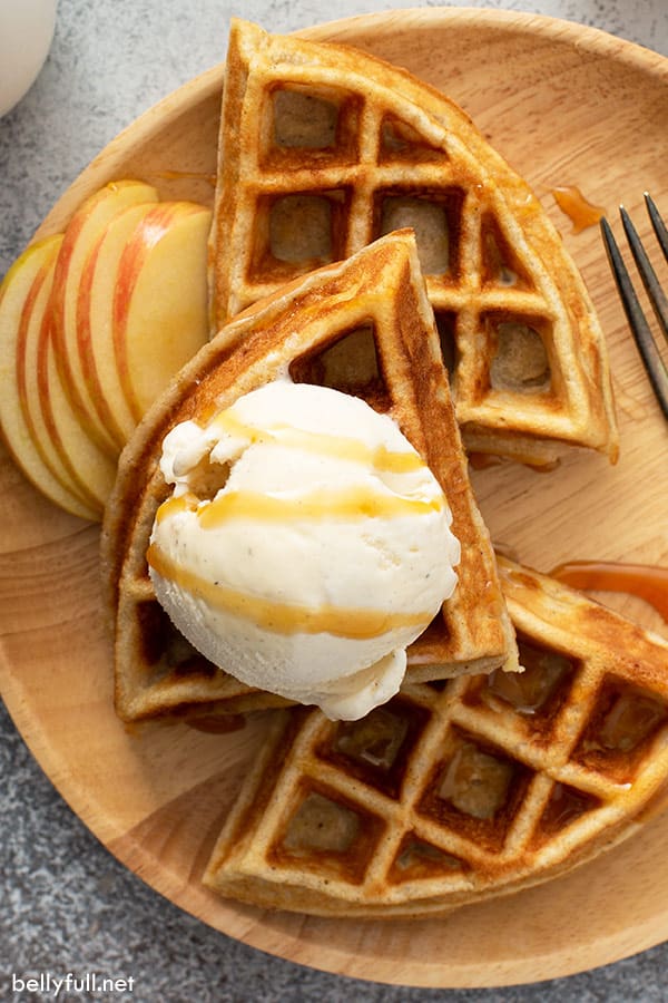 close up overhead of apple pie waffles with vanilla ice cream