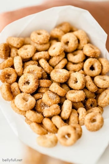 mini doughnut hot buttered Cheerios close up in paper cup