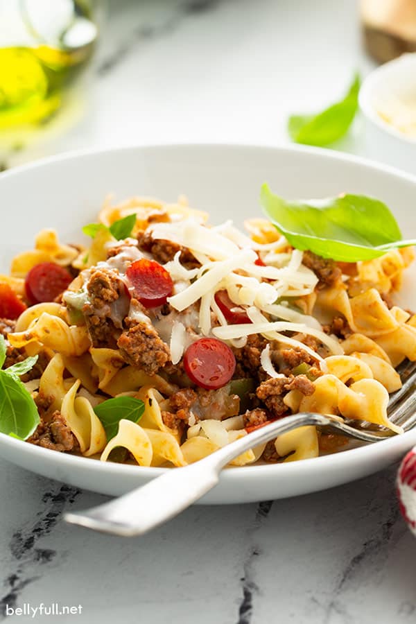 pizza pasta in white bowl with fork