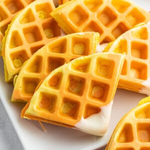 close up of candy corn colored waffles cut into triangles