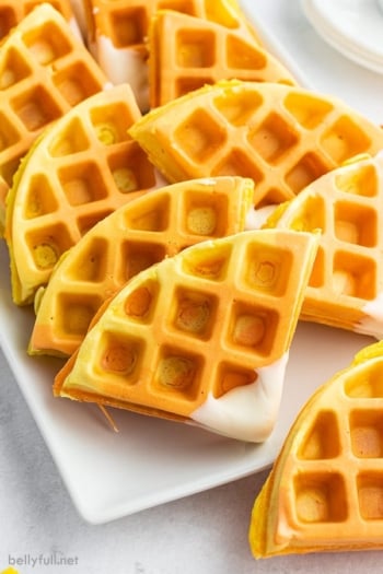 close up of candy corn colored waffles cut into triangles